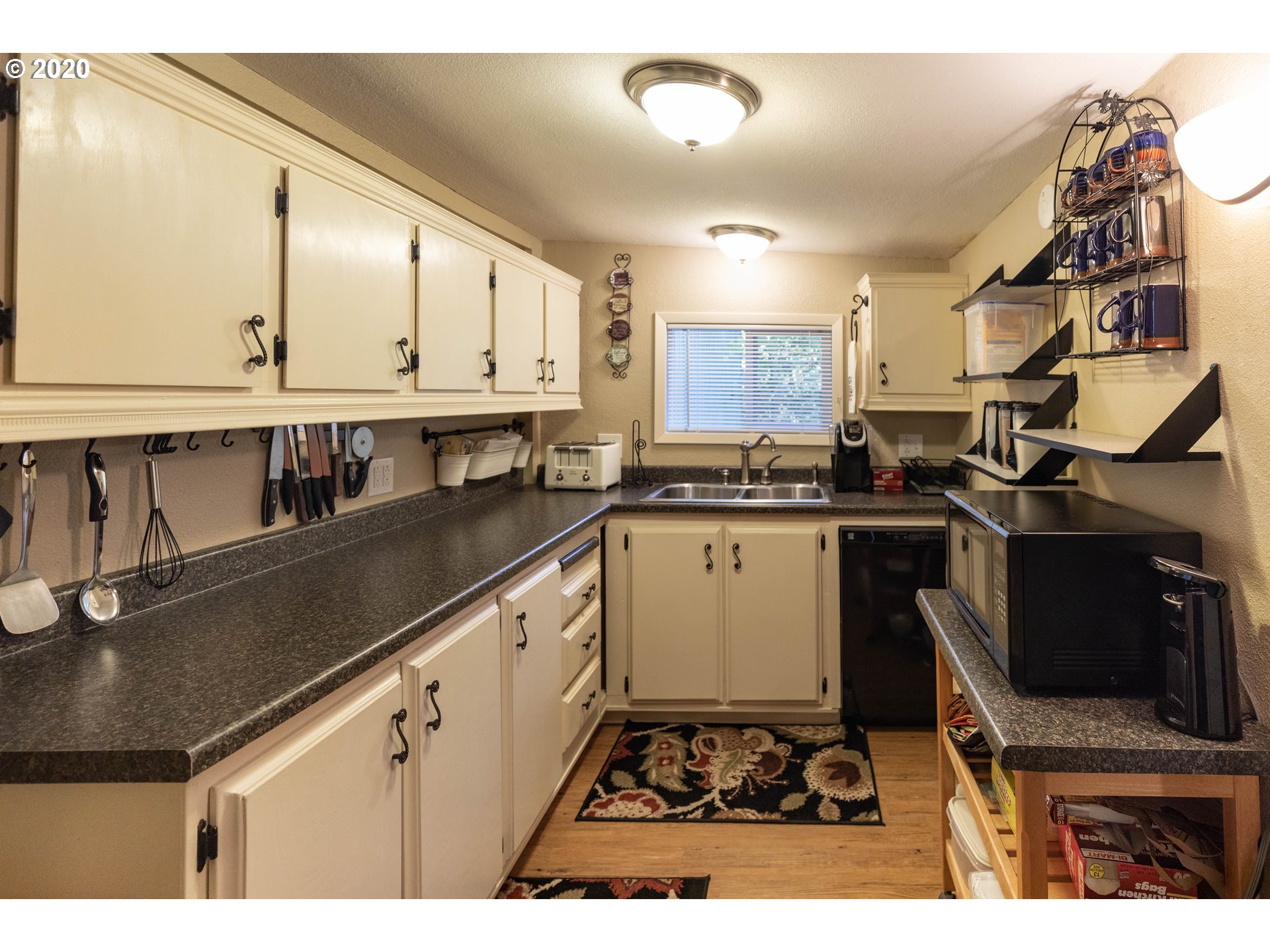 32487 Southeast Colorado Road Sandy, OR 97055 - Photo 25 of 31 a kitchen with a sink a stove and cabinets