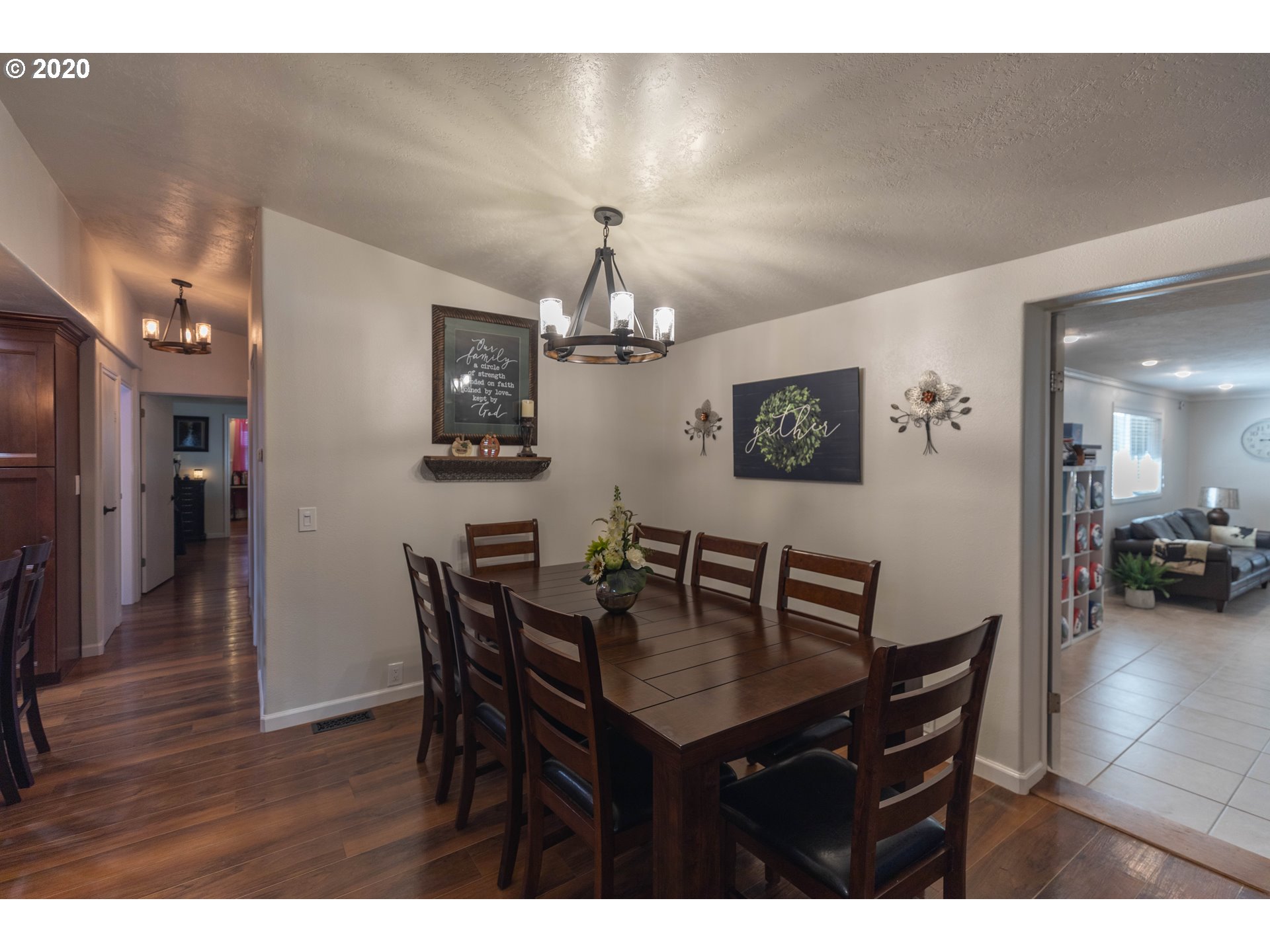 32487 Southeast Colorado Road Sandy, OR 97055 - Photo 7 of 31 a view of a dining room with furniture and wooden floor