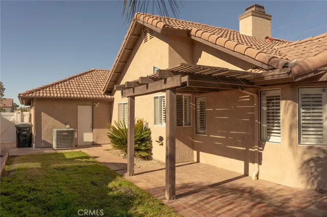 a bathroom with a granite countertop sink vanity and mirror