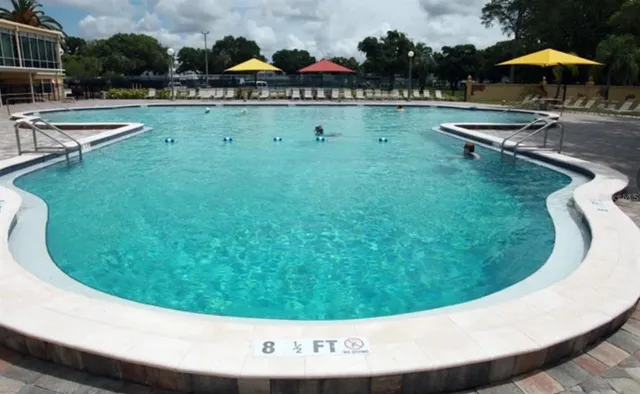 a view of a swimming pool with a patio