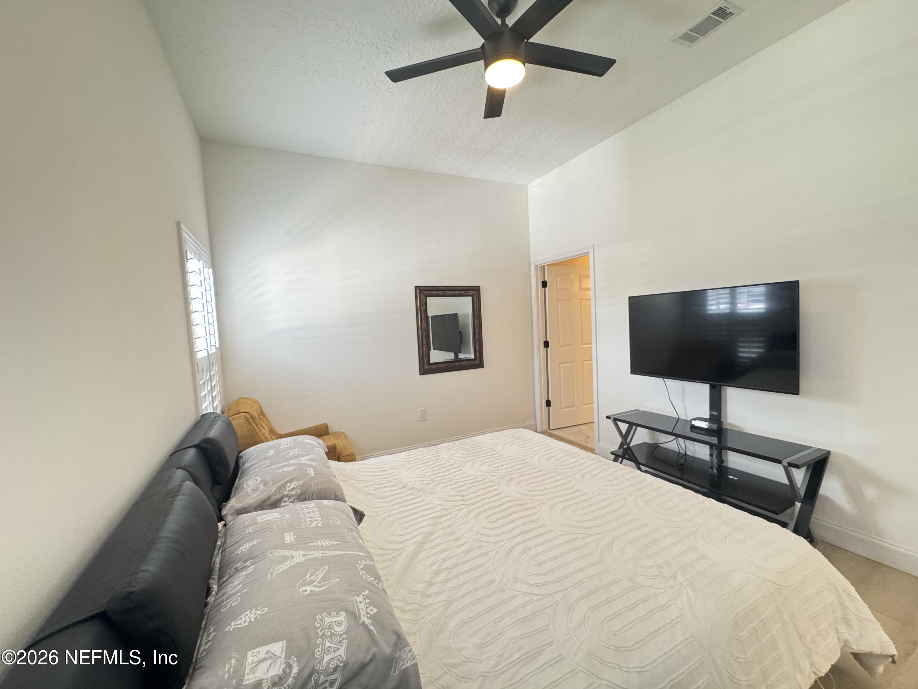 7920 Merrill Road, Unit 1205 Jacksonville, FL 32277 - Photo 13 of 25 Master Bedroom