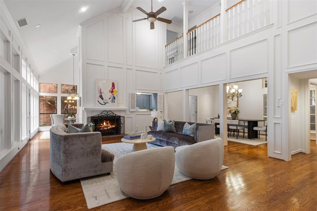 7 Queensview Court Dallas, TX 75225 - Photo 12 of 40 a living room with fireplace furniture and a large window