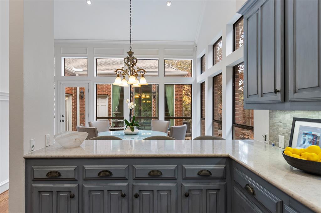 7 Queensview Court Dallas, TX 75225 - Photo 17 of 40 a kitchen with a counter space a sink and cabinets