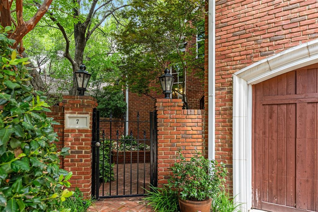 7 Queensview Court Dallas, TX 75225 - Photo 2 of 40 a view of a house with plants and wooden fence