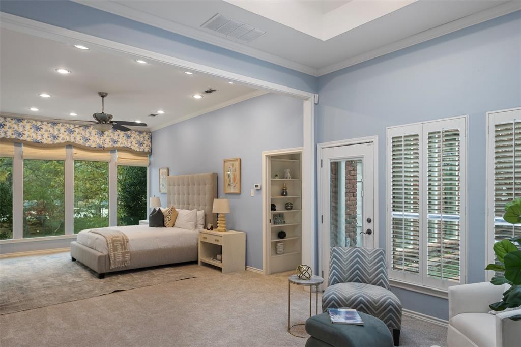 7 Queensview Court Dallas, TX 75225 - Photo 24 of 40 a bedroom with furniture and large windows