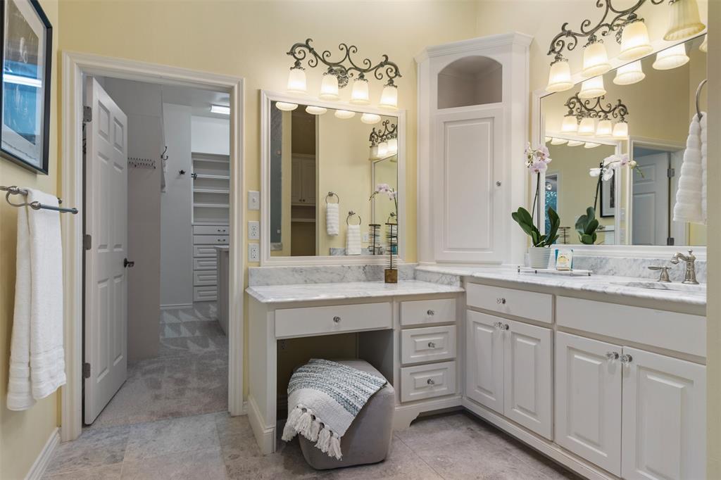 7 Queensview Court Dallas, TX 75225 - Photo 29 of 40 a bathroom with a double vanity sink and a mirror