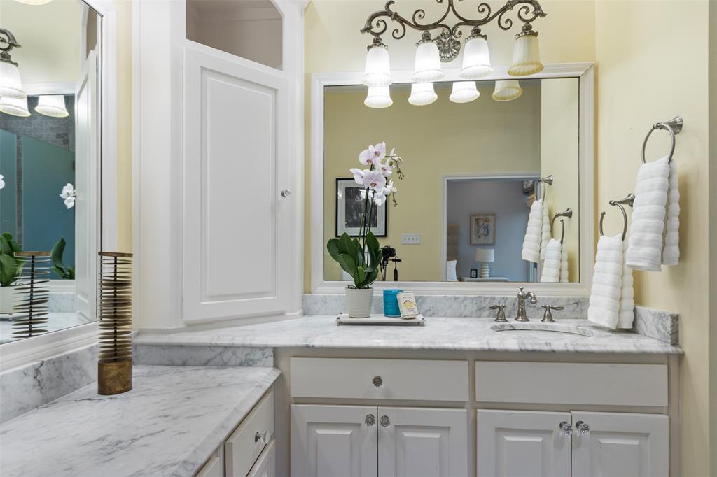 7 Queensview Court Dallas, TX 75225 - Photo 30 of 40 a bathroom with a granite countertop sink and a mirror