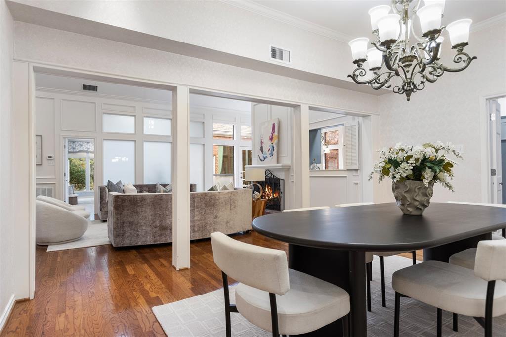 7 Queensview Court Dallas, TX 75225 - Photo 9 of 40 a view of a dining room with furniture wooden floor and chandelier
