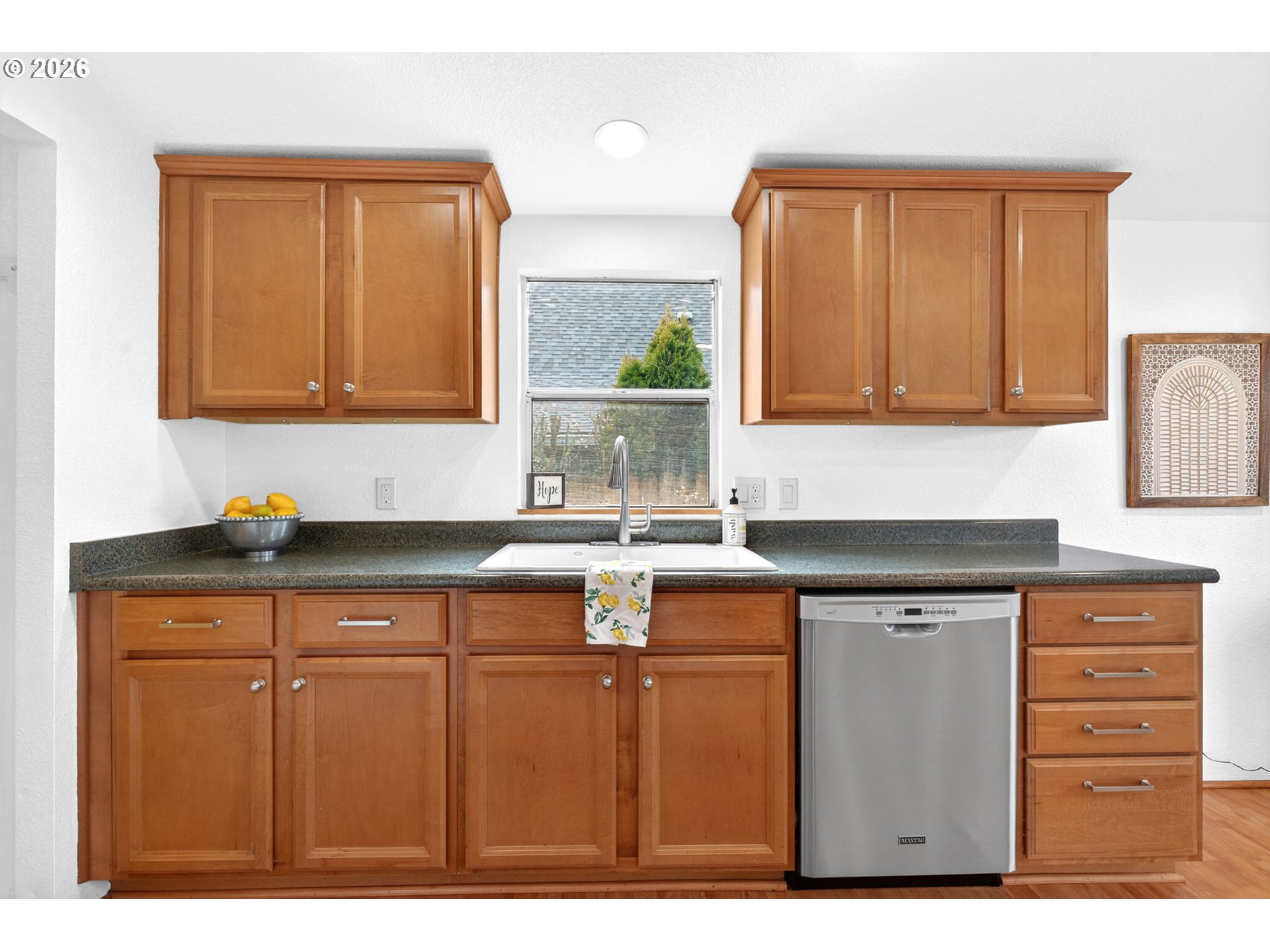 110 South Harrison Street Newberg, OR 97132 - Photo 11 of 41 a kitchen with a sink cabinets and a window