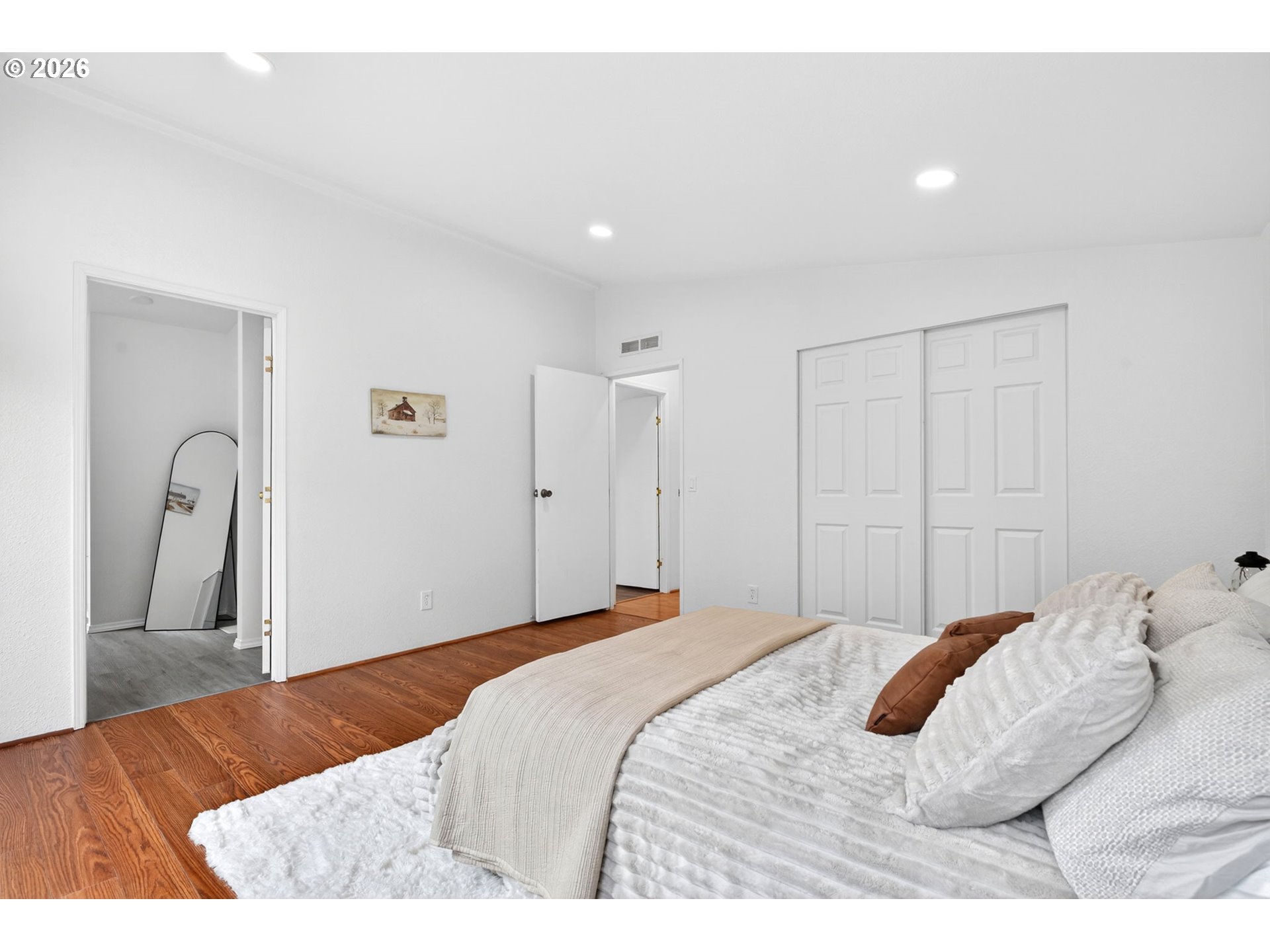110 South Harrison Street Newberg, OR 97132 - Photo 18 of 41 a bedroom with a bed and a mirror