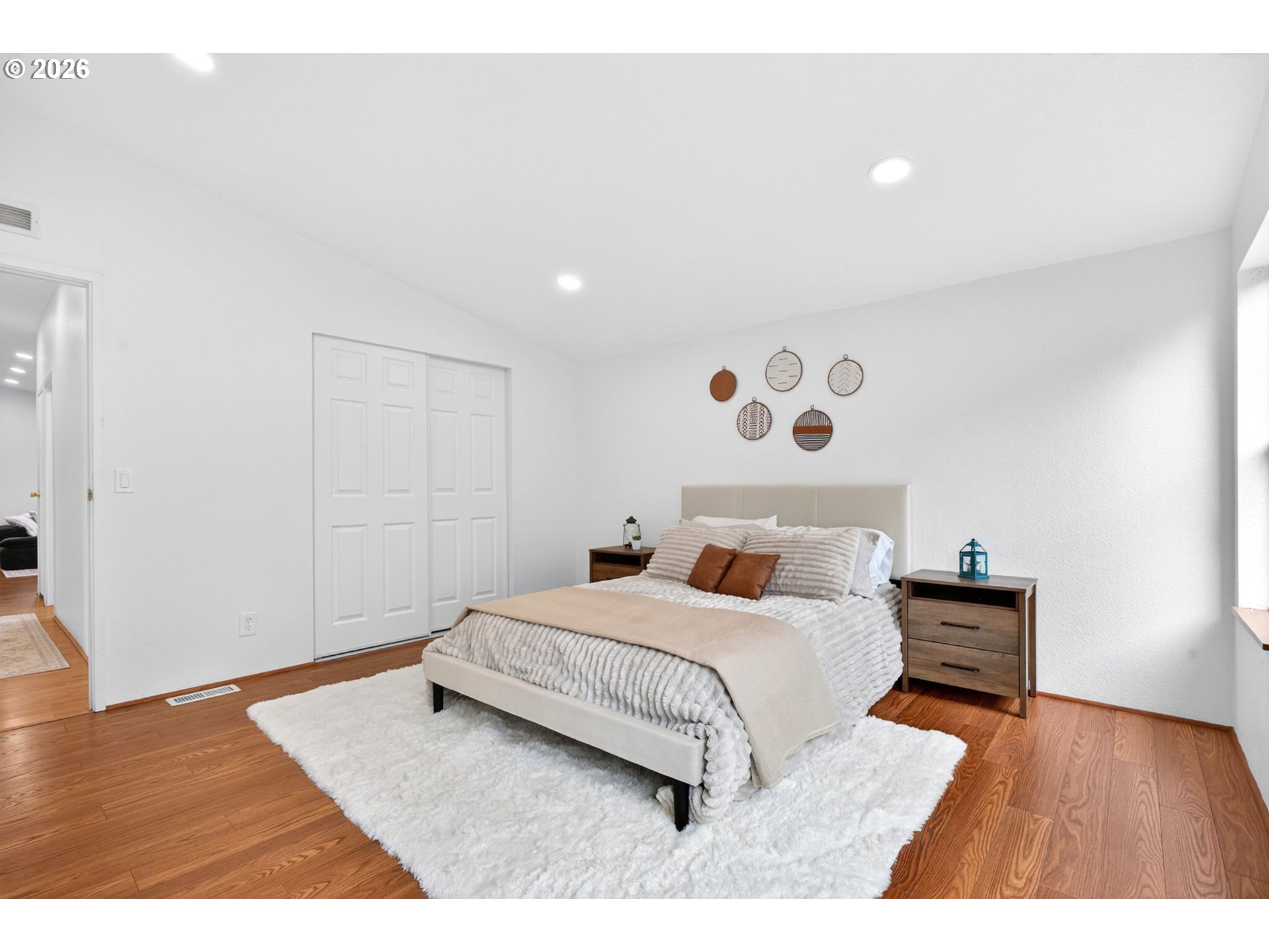 110 South Harrison Street Newberg, OR 97132 - Photo 19 of 41 a bedroom with a bed and wooden floor