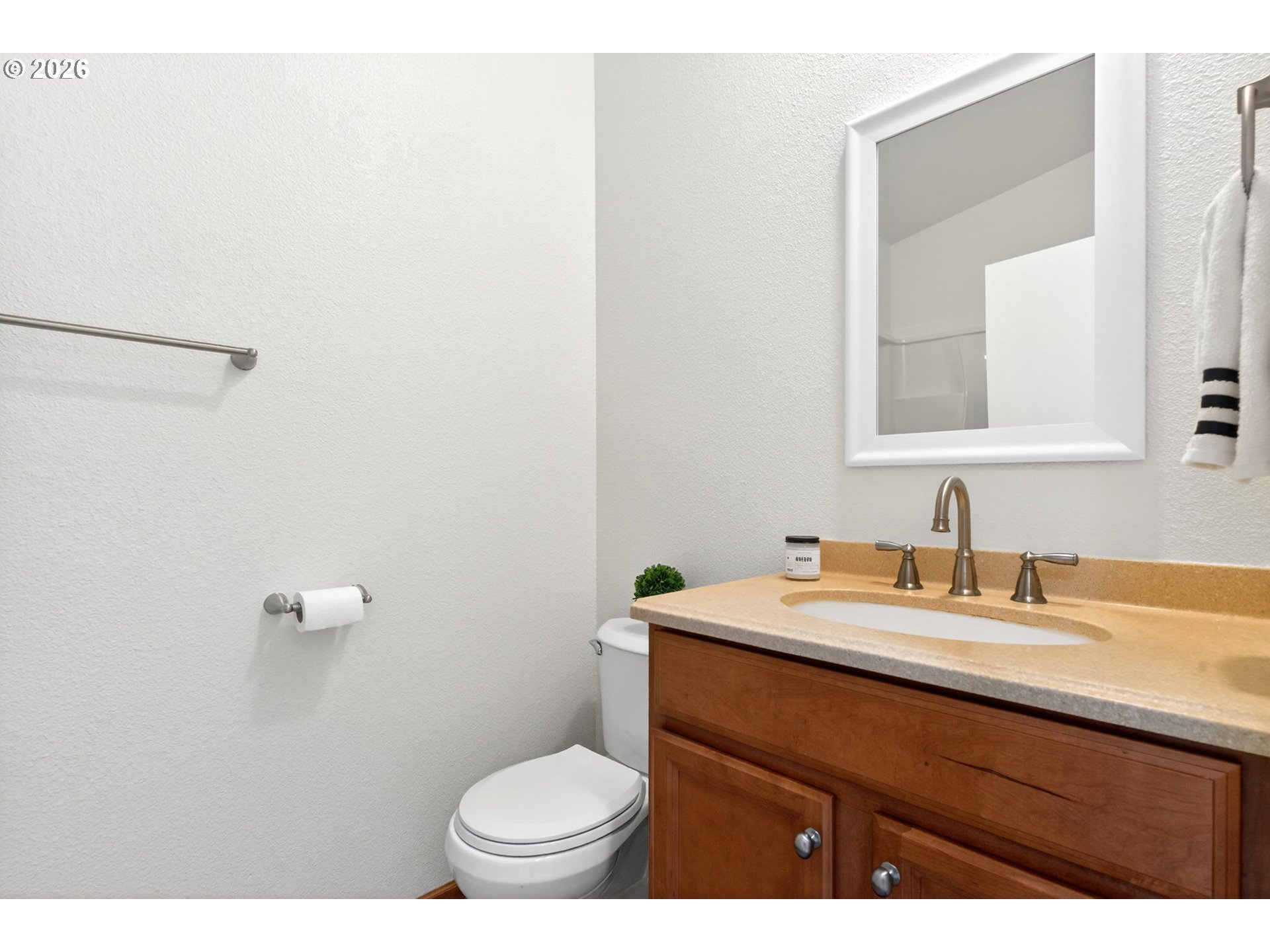 110 South Harrison Street Newberg, OR 97132 - Photo 26 of 41 a bathroom with a sink a toilet and mirror