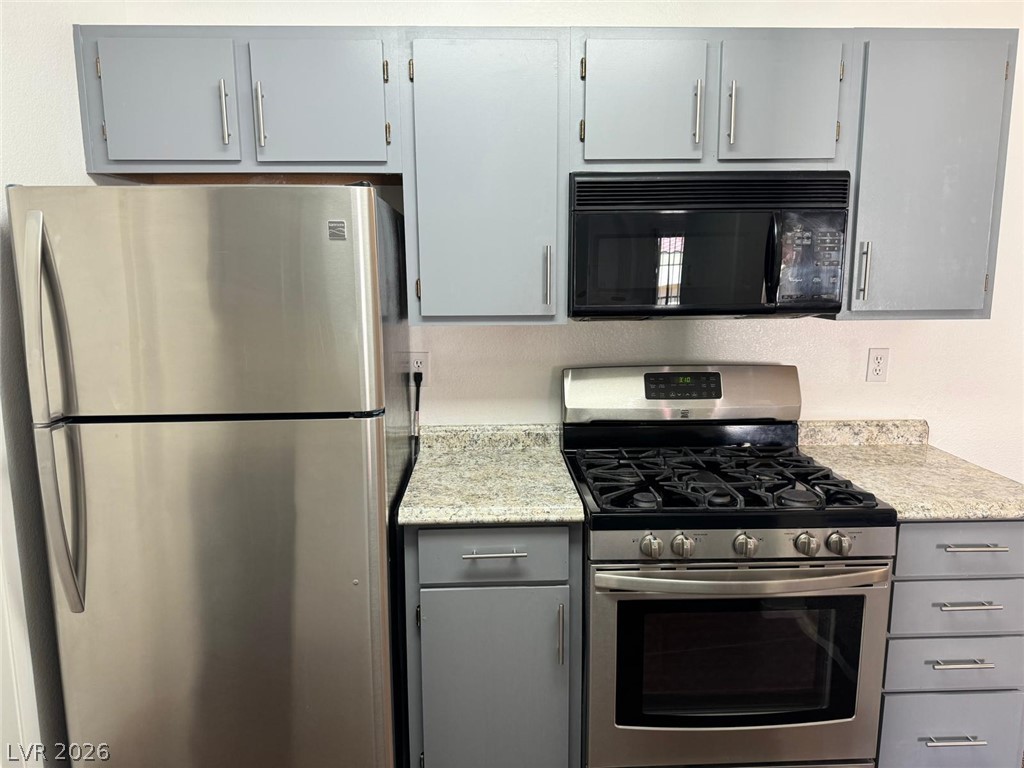 7885 West Flamingo Road, Unit 2171 Las Vegas, NV 89147 - Photo 7 of 22 Modern kitchen equipped with sleek stainless steel appliances and ample counter space.