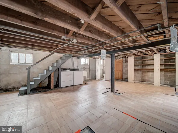 a view of an empty room with wooden walls