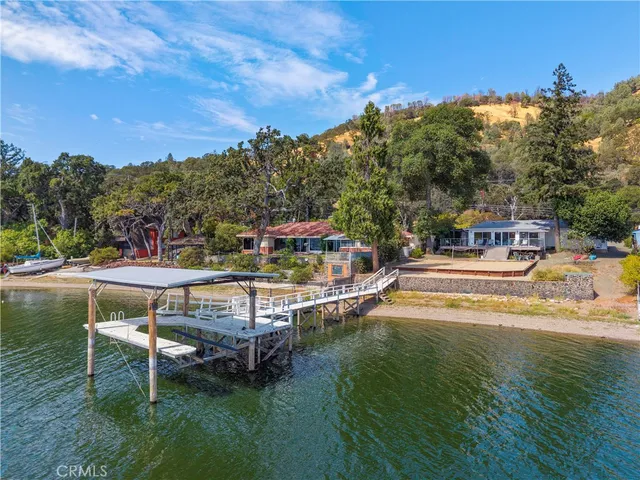 a view of a patio with chairs and wooden floor