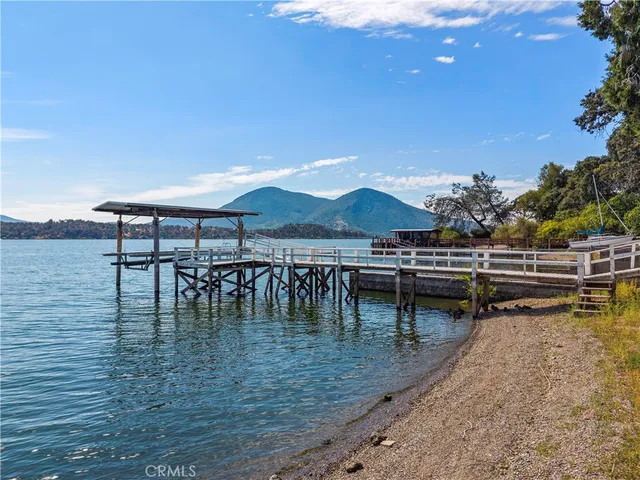 a view of a house with backyard porch and sitting area