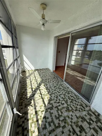 a bedroom with a bed and a mirror