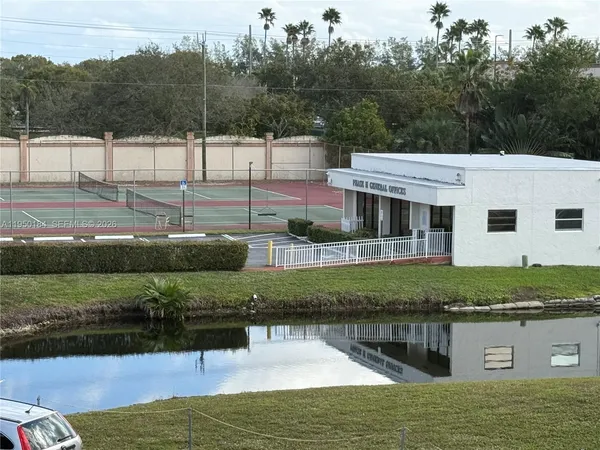 a view of a lake with a yard