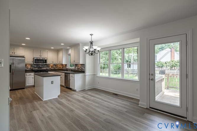 6118 Springwood Road Chester, VA 23831 - Photo 11 of 38 Kitchen and dining area featuring light wood-finis