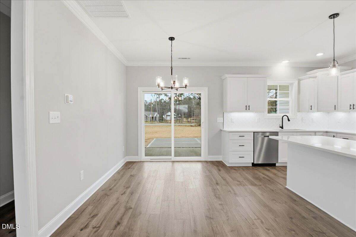 1381 Scarlet Oak Rd Spring Spring Hope, NC 27882 - Photo 14 of 23 a living room with stainless steel appliances furniture or kitchen and a wooden floor