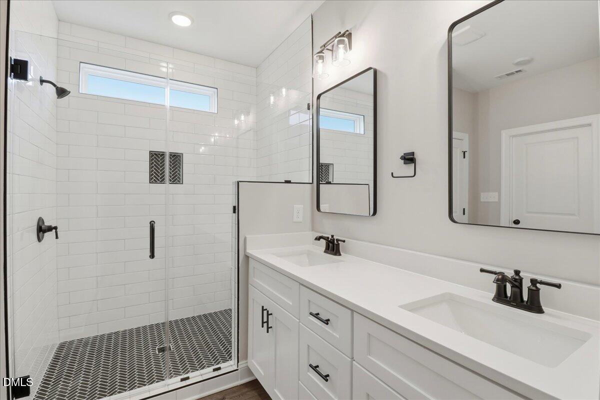 1381 Scarlet Oak Rd Spring Spring Hope, NC 27882 - Photo 19 of 23 a bathroom with a sink and a mirror