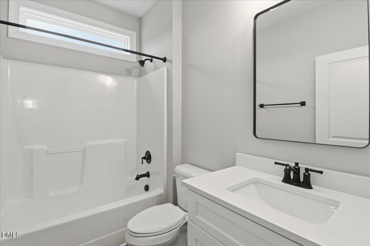 1381 Scarlet Oak Rd Spring Spring Hope, NC 27882 - Photo 22 of 23 a bathroom with a sink toilet and shower