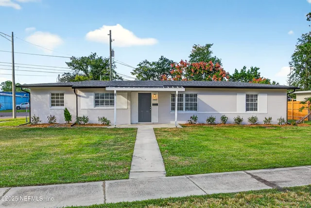 front view of a house with a yard