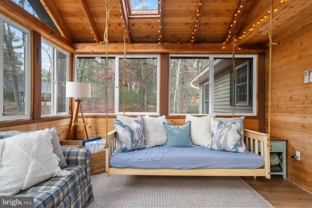 a view of living room with furniture and a large window