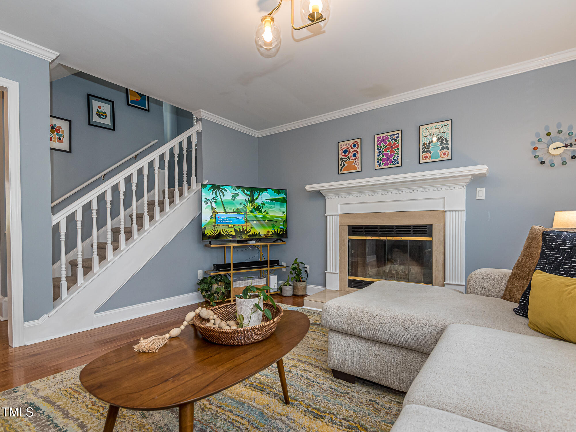 4617 Atterbury Court Raleigh, NC 27604 - Photo 10 of 41 a living room with furniture and a fireplace