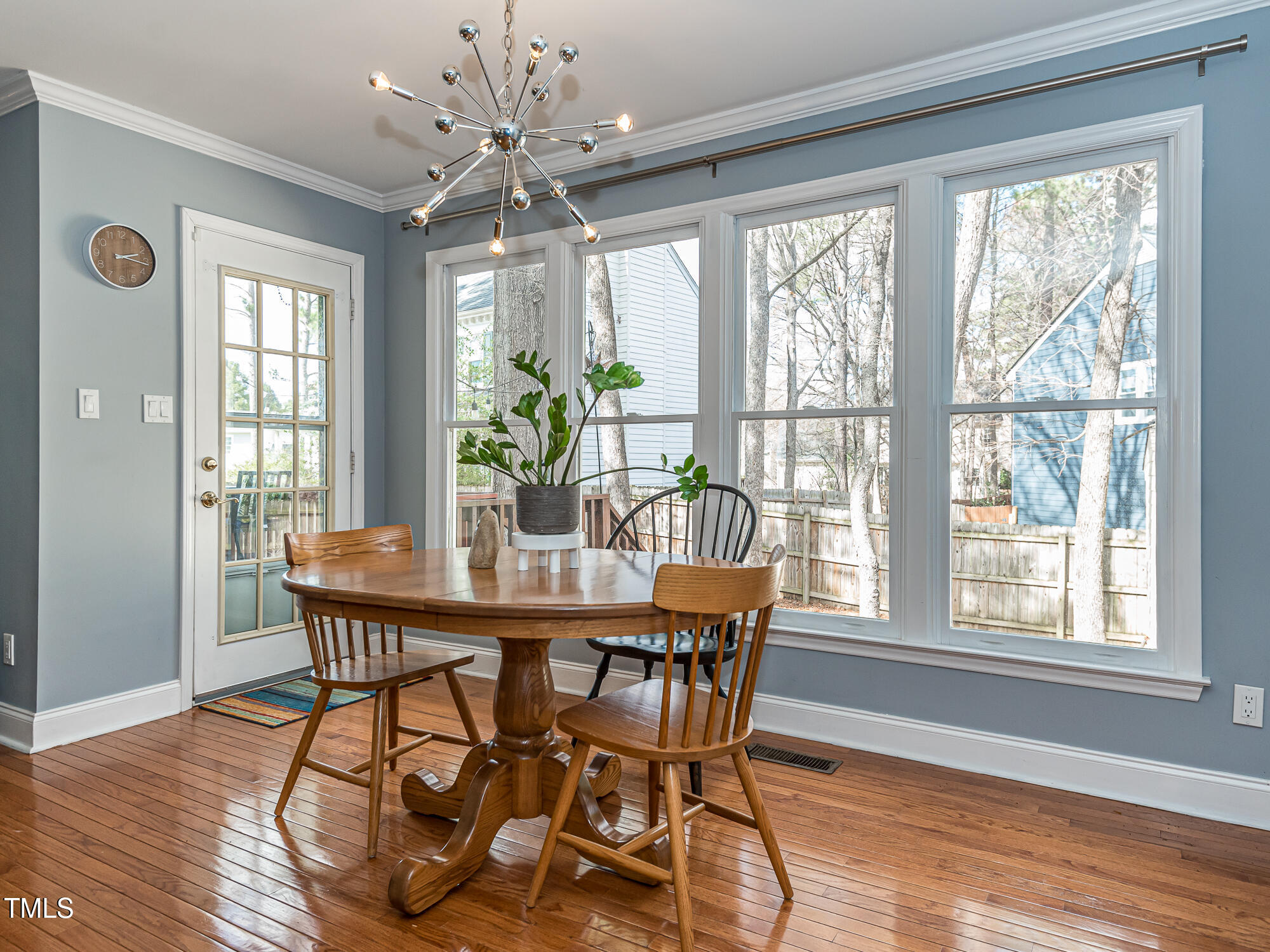 4617 Atterbury Court Raleigh, NC 27604 - Photo 16 of 41 a view of a dining room with furniture window and wooden floor
