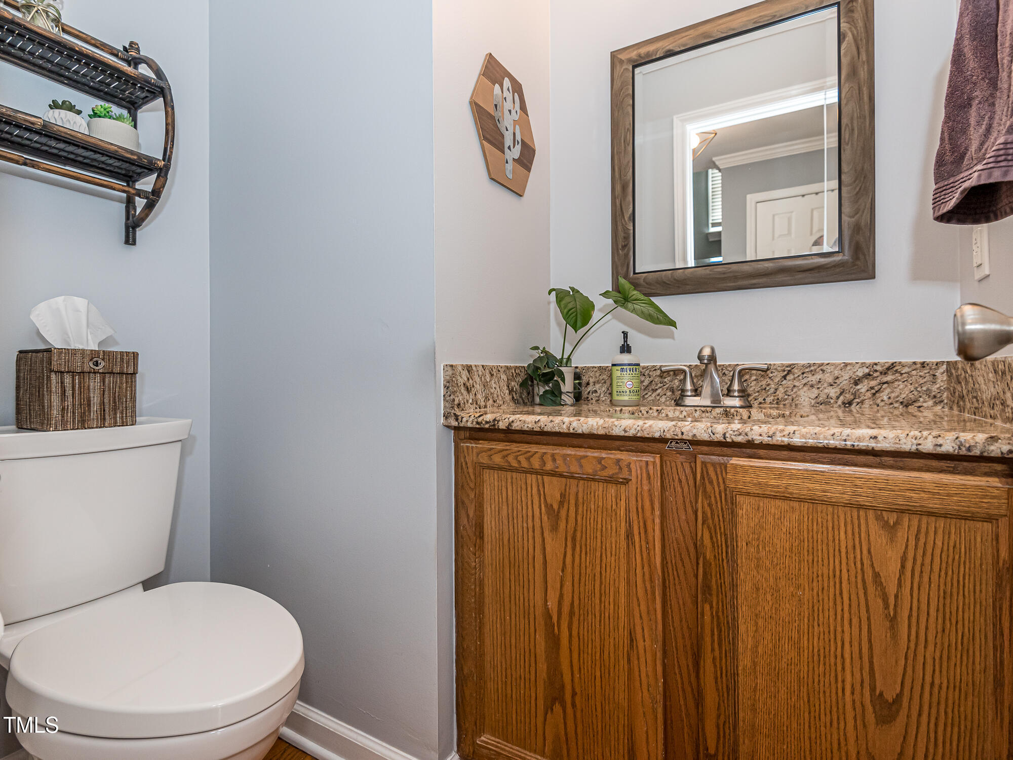 4617 Atterbury Court Raleigh, NC 27604 - Photo 17 of 41 a bathroom with a granite countertop toilet sink and mirror