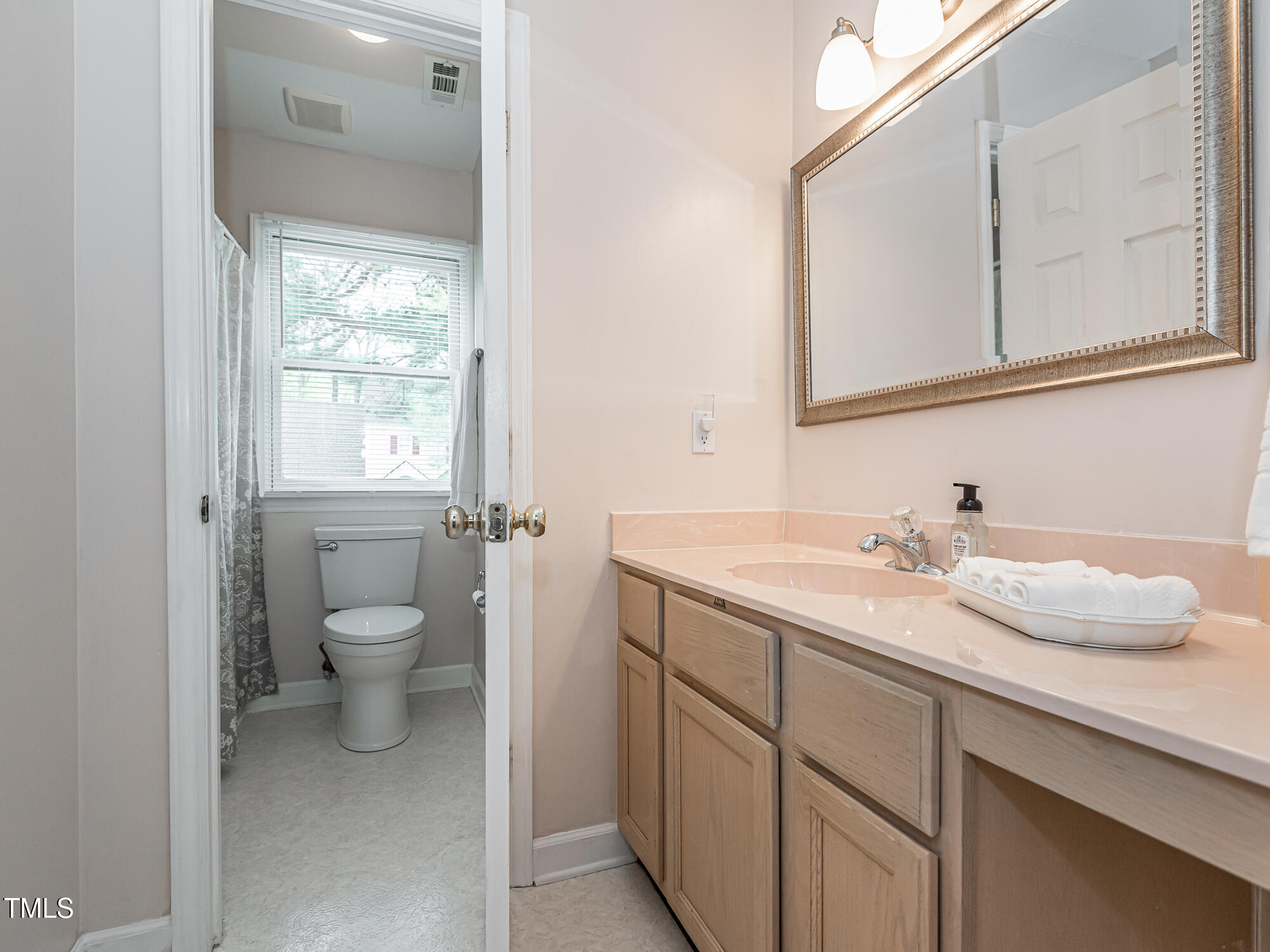 4617 Atterbury Court Raleigh, NC 27604 - Photo 28 of 41 a bathroom with a granite countertop sink and a toilet