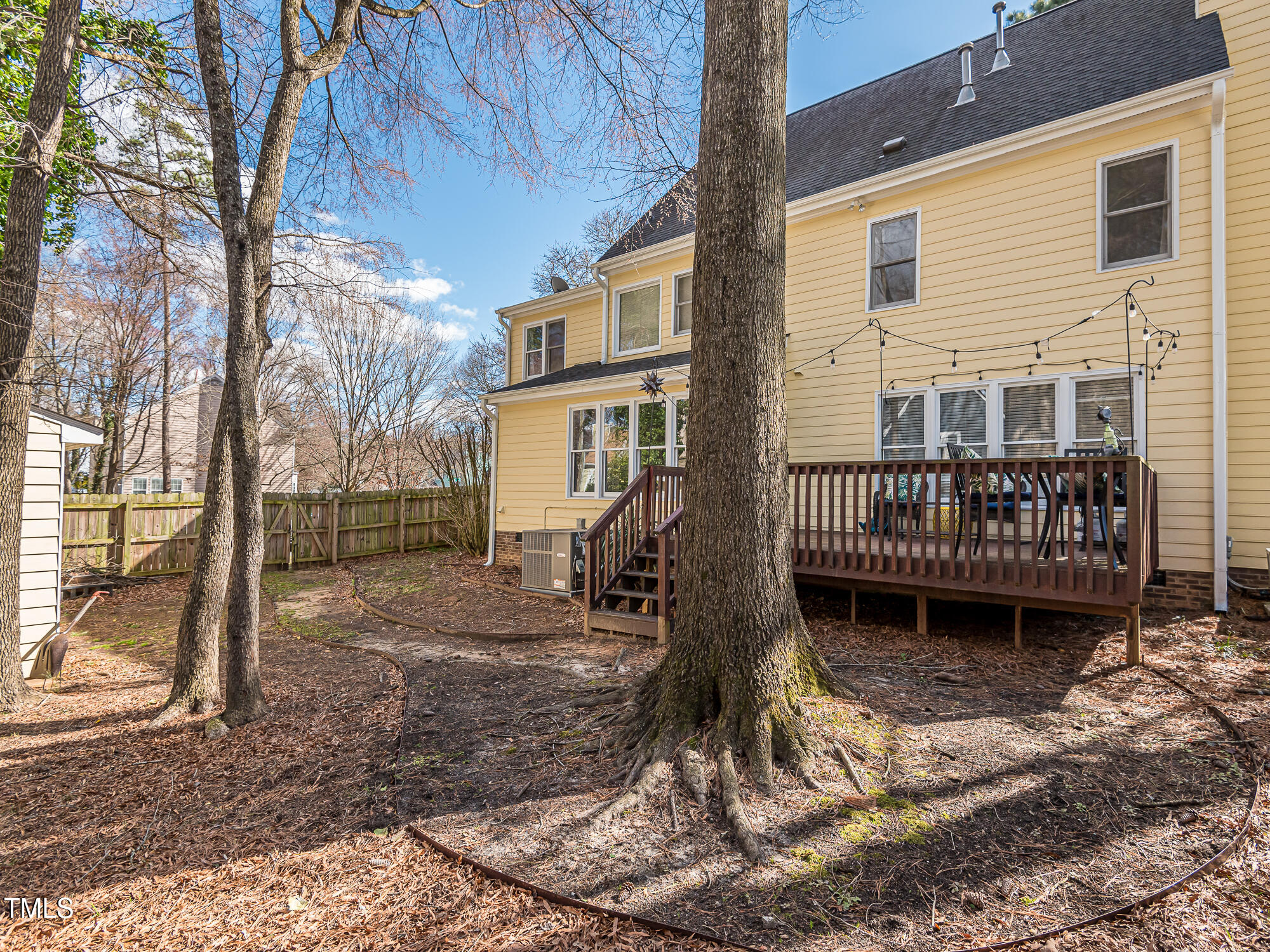 4617 Atterbury Court Raleigh, NC 27604 - Photo 34 of 41 a view of a house with a wooden deck and a backyard