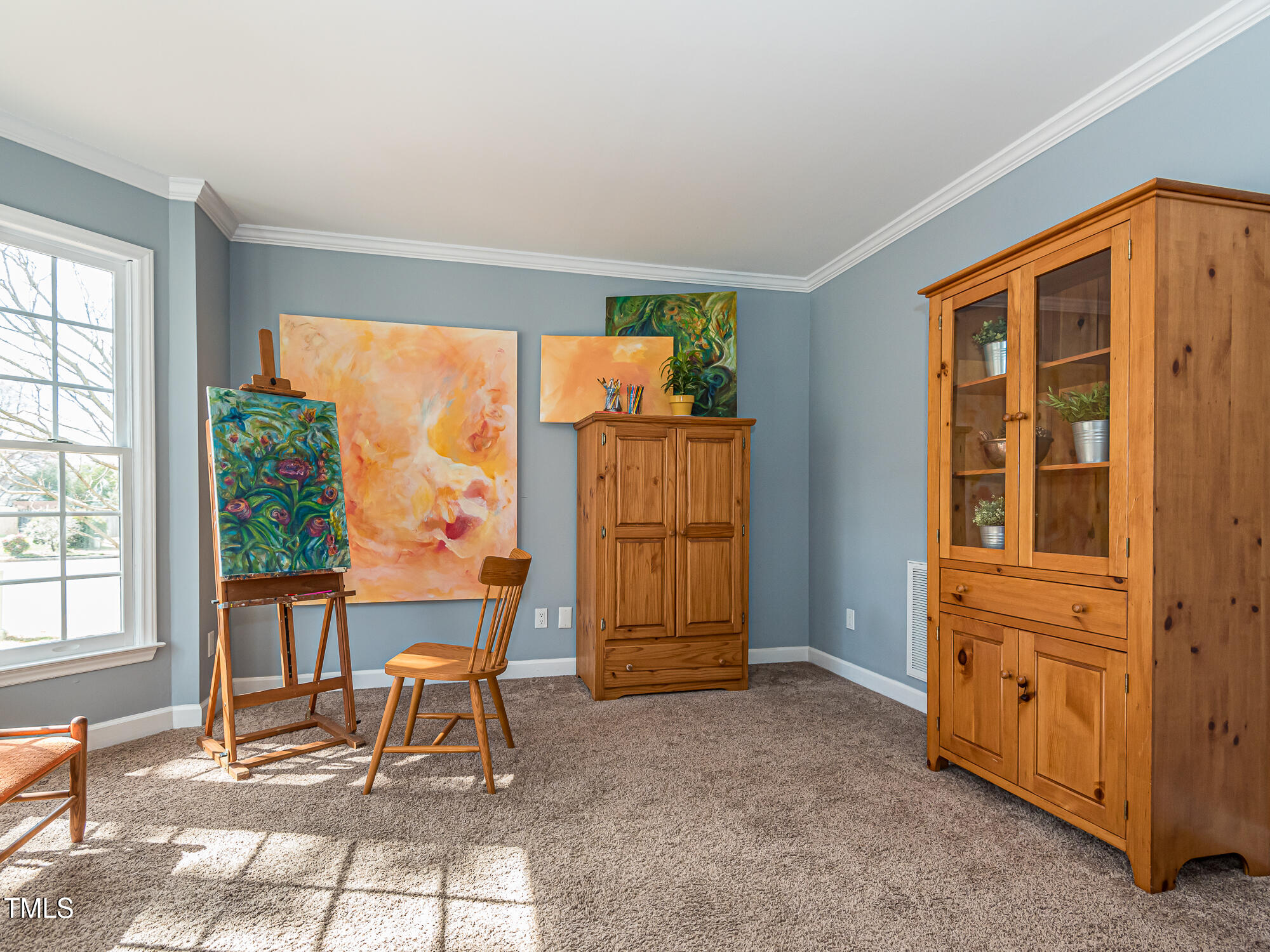 4617 Atterbury Court Raleigh, NC 27604 - Photo 6 of 41 a view of an empty room with a birdcage and a window