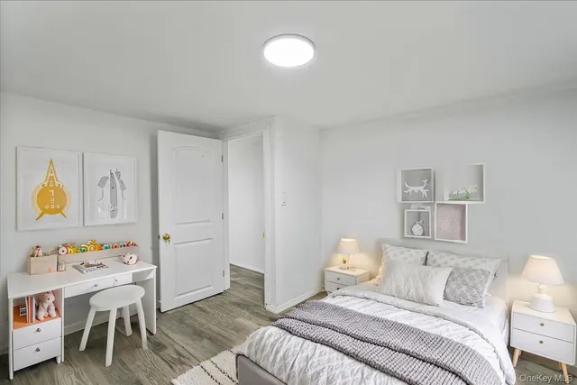 a bedroom with a bed and a table in it