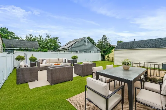 a balcony with furniture and a table