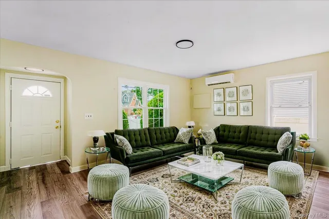 a living room with furniture and a window