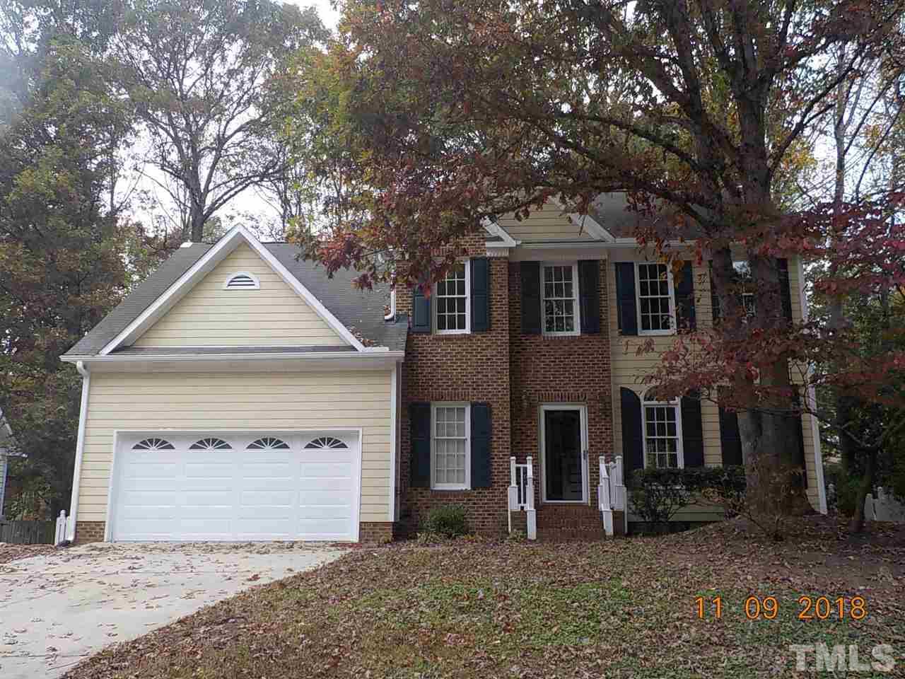 3317 Singleleaf Lane Raleigh, NC 27616 - Photo 1 of 19 a front view of a house with a yard and garage