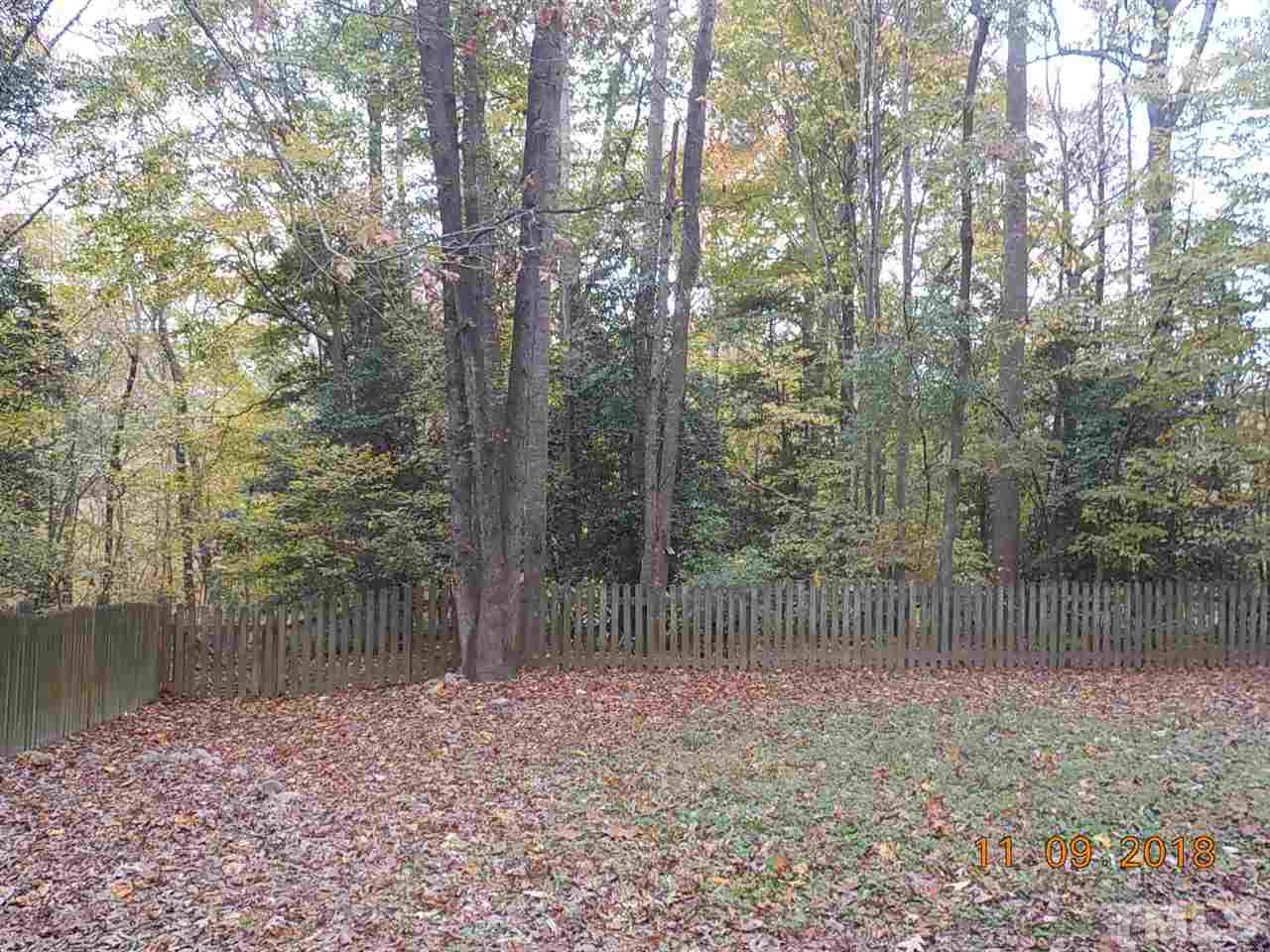3317 Singleleaf Lane Raleigh, NC 27616 - Photo 18 of 19 a backyard of a house with lots of green space
