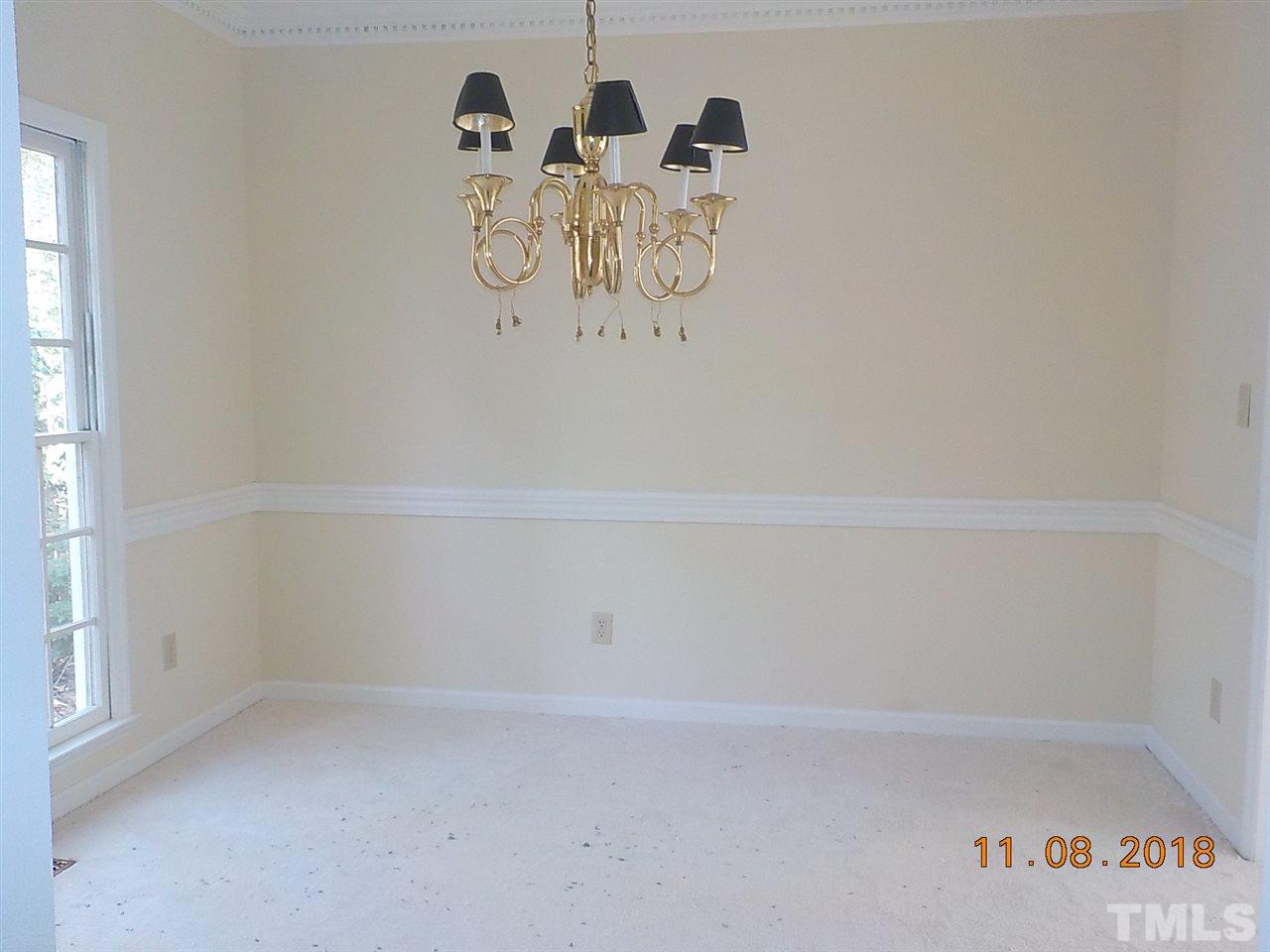 3317 Singleleaf Lane Raleigh, NC 27616 - Photo 3 of 19 a view of small space with racks on the wall