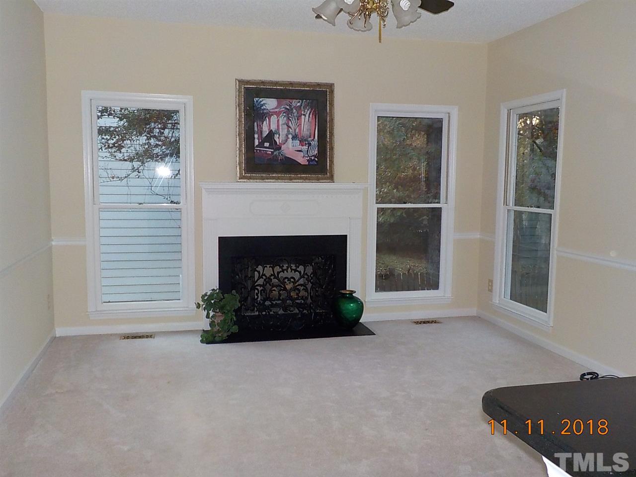3317 Singleleaf Lane Raleigh, NC 27616 - Photo 4 of 19 a living room with furniture and a fireplace