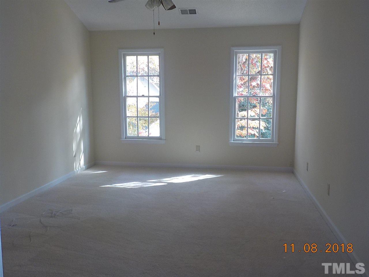 3317 Singleleaf Lane Raleigh, NC 27616 - Photo 9 of 19 an empty room that has a window