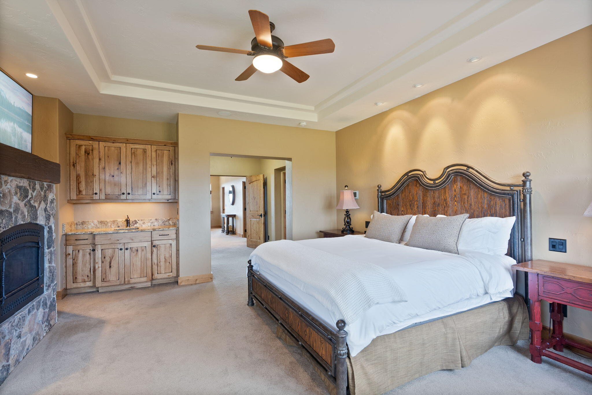 22887 Ghost Tree Lane Bend, OR 97701 - Photo 46 of 97 The stunning primary suite boasts a fireplace, sitting area, coffee bar, spa-like bath, private balcony & expansive views.