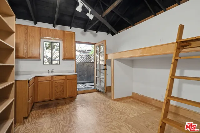 a view of a kitchen with a sink and a dishwasher