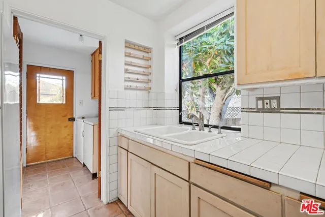 a kitchen with a sink and a window