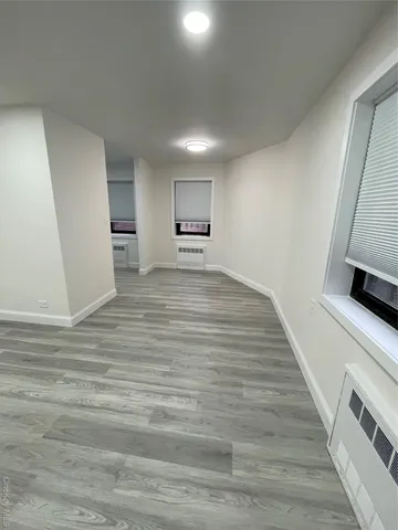 a view of a livingroom with wooden floor