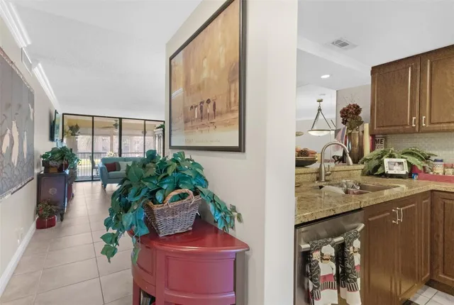 a hallway with a sink and a mirror