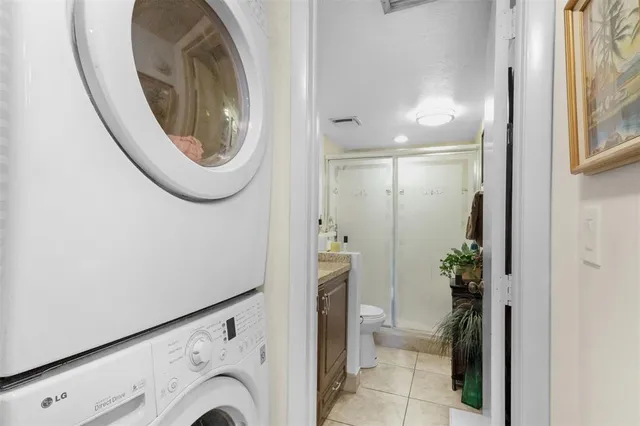 a view of a hallway with washer and dryer