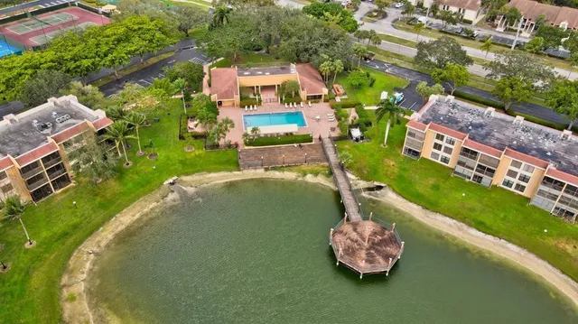 a bird view of a house with a yard