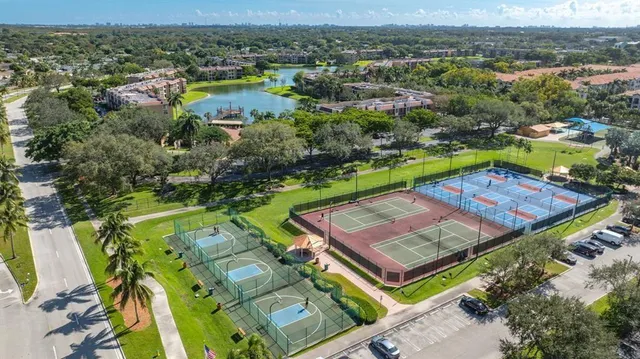 an aerial view of a house with a swimming pool